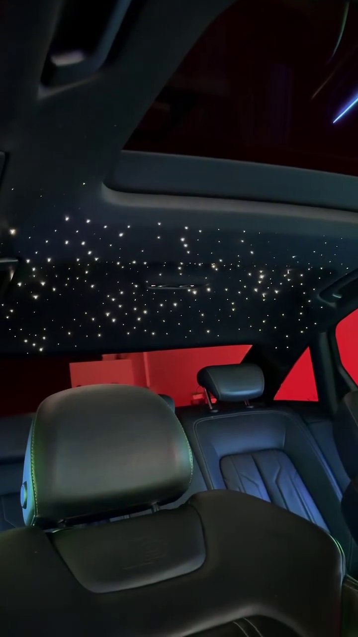 White star lights across a car headliner