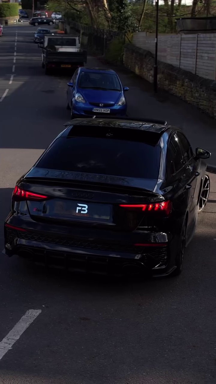 Rear view of a black Audi on a street