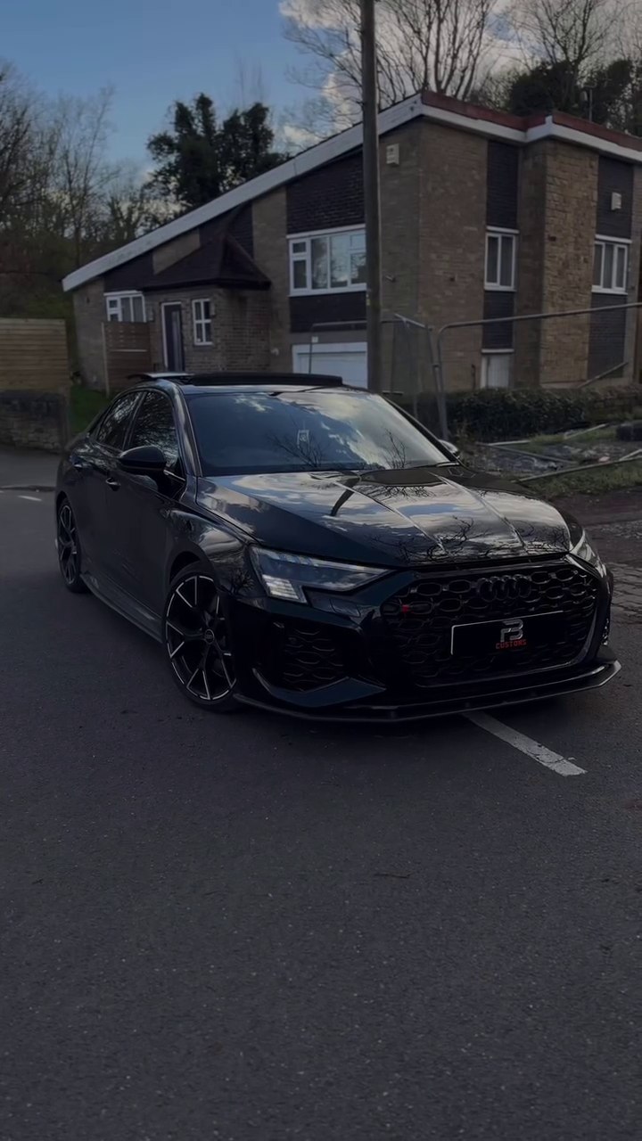 Front view of a black Audi on a street