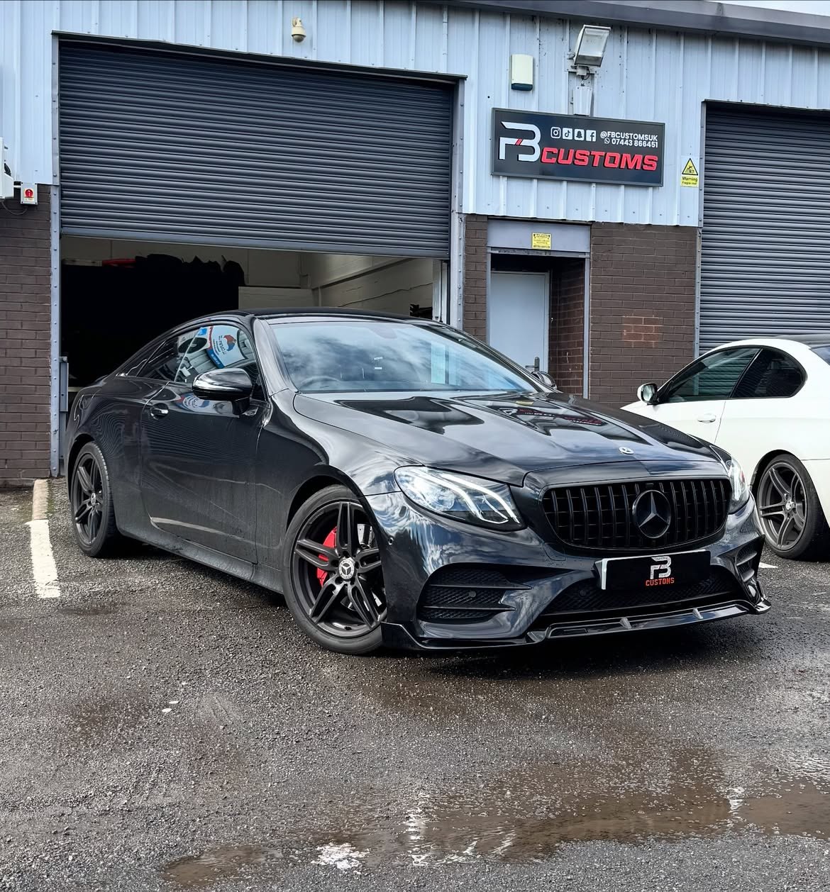 Black Mercedes outside FB CUSTOMS with fitted exterior styling